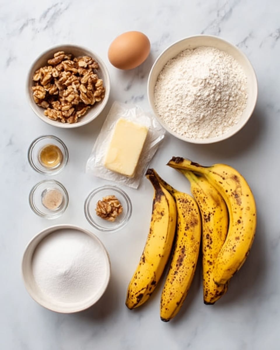 The image shows a top-down view of ingredients arranged neatly on a white marbled surface. There are three ripe bananas with brown spots on their yellow skin placed on the right side. To the left, there is a small white bowl filled with chopped walnuts and another white bowl holding white flour. A plain brown egg is placed near the center, alongside a small piece of butter wrapped in paper. A white bowl filled with sugar is placed beside the flour. Around these main ingredients, there are also four small clear glass bowls, each containing small amounts of different ingredients, including a light brown powder, a liquid, and some crystals. Photo taken with an iphone --ar 4:5 --v 7