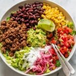 Taco Salad Bowl with Spiced Ground Beef, Corn, Black Beans, and Fresh Toppings Recipe