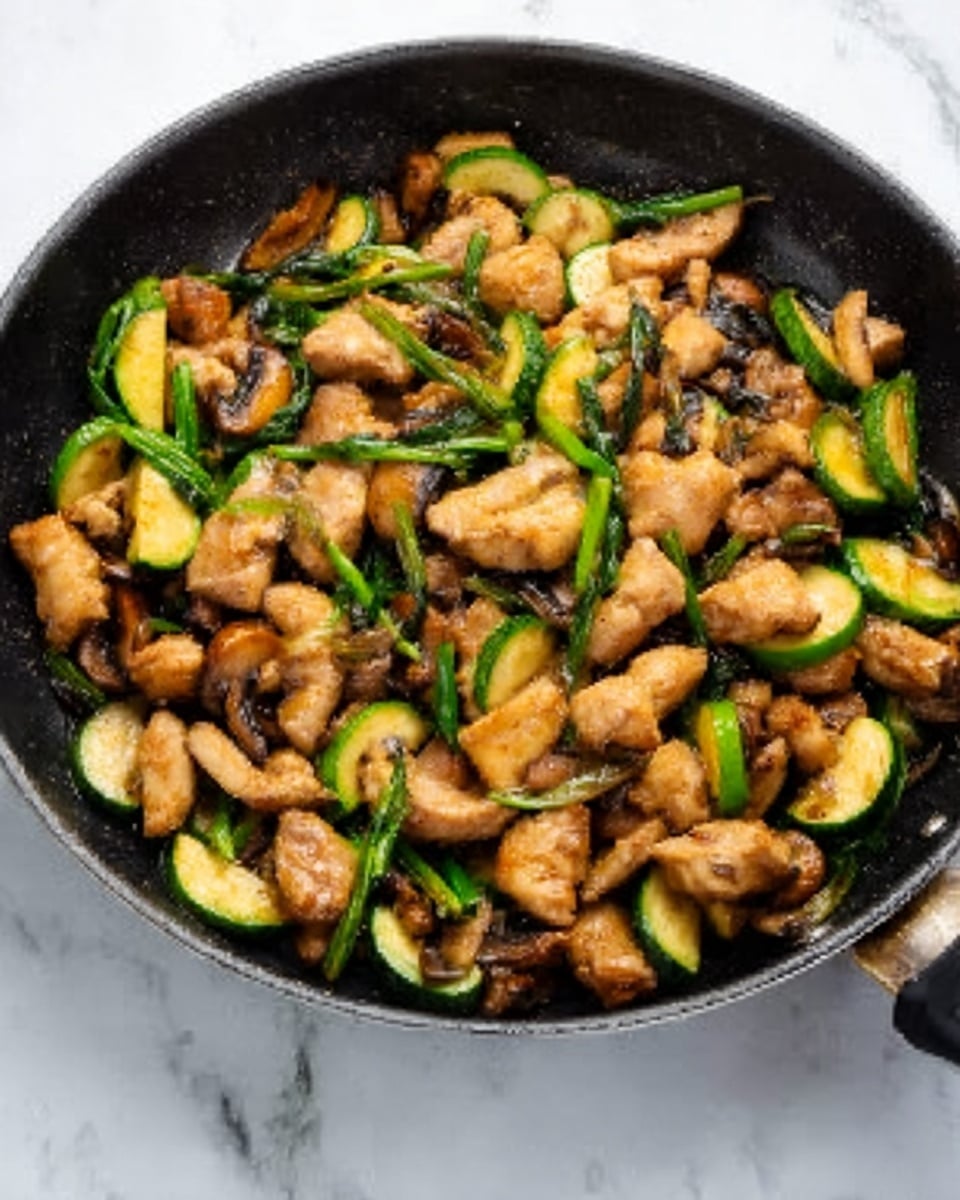 The image shows two stages of cooking inside a black pan placed on a white marbled surface. On the left side, the pan is filled with pieces of light green zucchini with dark green skins and small white mushrooms, all chopped roughly. On the right side, the same pan displays cooked chicken pieces with a light brown color layered over the zucchini and mushrooms, with a rich dark brown sauce being poured on top. The textures show the rawness of vegetables contrasting with the softness and glossiness of the cooked chicken and sauce. photo taken with an iphone --ar 4:5 --v 7