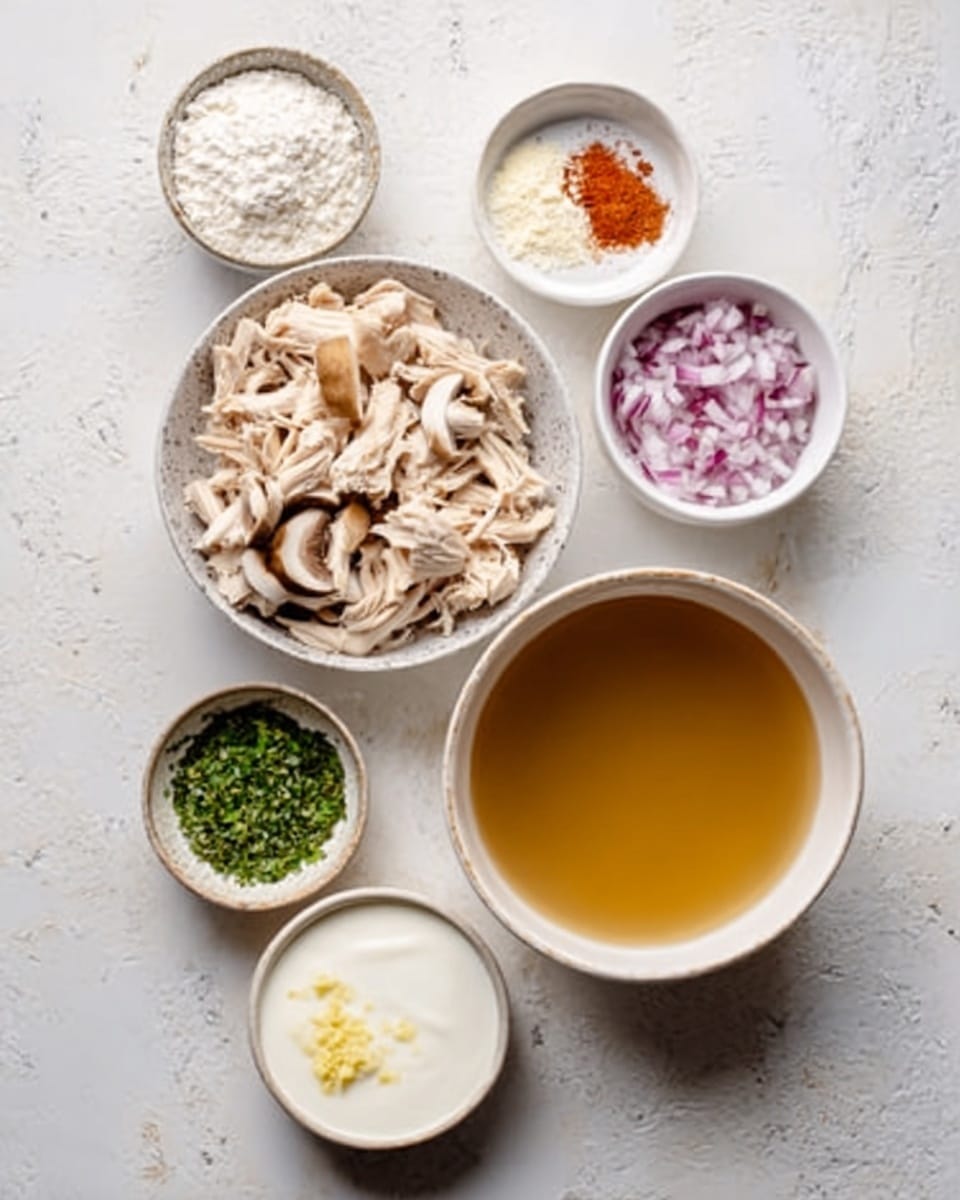 The image shows seven small white bowls on a white marbled surface. The largest bowl at the bottom holds a golden brown broth with a smooth texture. Above it, there is a bowl filled with chopped white chicken meat. To the left of this bowl is another filled with sliced mushrooms in light beige and brown colors. To the right, there is a bowl containing finely chopped red onions. Next to the onion bowl is another bowl with a mix of white flour and a small amount of red powder on top. Above these is a bowl with thick white cream. To the left of the cream bowl, there is a small bowl with finely chopped green herbs, and just below it, a tiny bowl with minced yellow garlic. All bowls are neatly arranged and the setup looks clean and fresh. Photo taken with an iphone --ar 4:5 --v 7