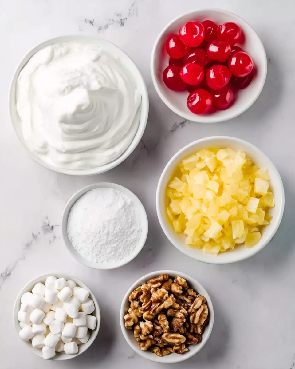 The image shows six white bowls with different ingredients placed on a white marbled surface. At the top left is a bowl filled with smooth, white whipped cream with soft peaks. To the right, there is a bowl with bright red maraschino cherries, shiny and round with stems. Below the whipped cream is a bowl of fine white powdered sugar. Next to it on the right, there is a bowl filled with yellow crushed pineapple pieces. At the bottom left, a bowl holds small, soft white mini marshmallows. Finally, at the bottom right is a bowl with chopped brown walnuts. photo taken with an iphone --ar 4:5 --v 7