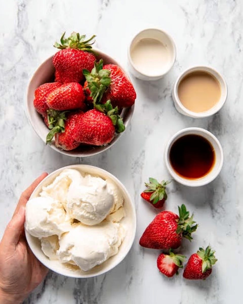 The image shows a white bowl filled with big, red strawberries with green leaves on top, placed on a white marbled surface. Nearby, there is a white bowl filled with large pieces of plain white ice cream. Around these bowls, there are three small white cups holding different liquids: one cream-colored, one brown, and one white. Two strawberries are lying on the white marbled surface near the bowls. A woman's hand is holding the bowl with strawberries on the left side of the image. photo taken with an iphone --ar 4:5 --v 7