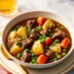 Hearty Beef Stew with Potatoes, Carrots, and Peas Recipe