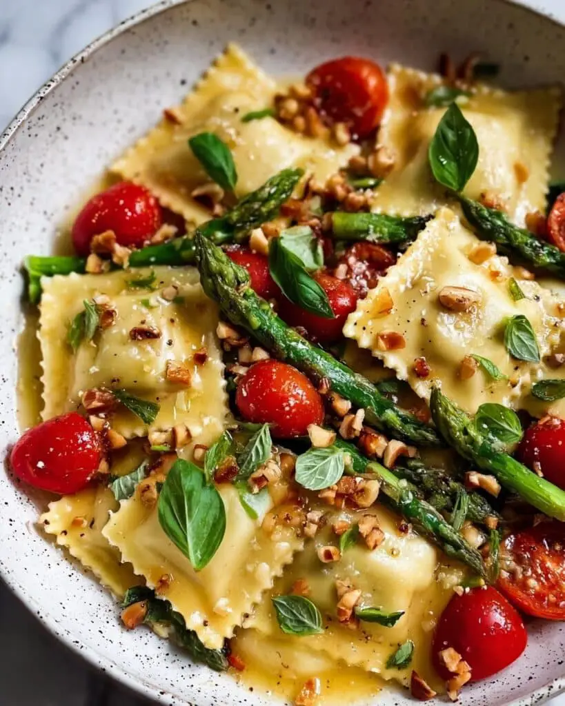 Sun-Kissed Ravioli with Tomato, Asparagus, and Herbs Recipe