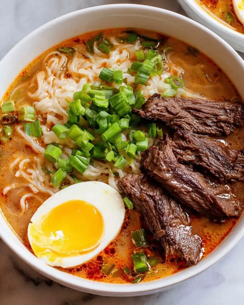 Spicy Korean Ramen with Seared Steak, Soft-Boiled Eggs, and Green Onions Recipe