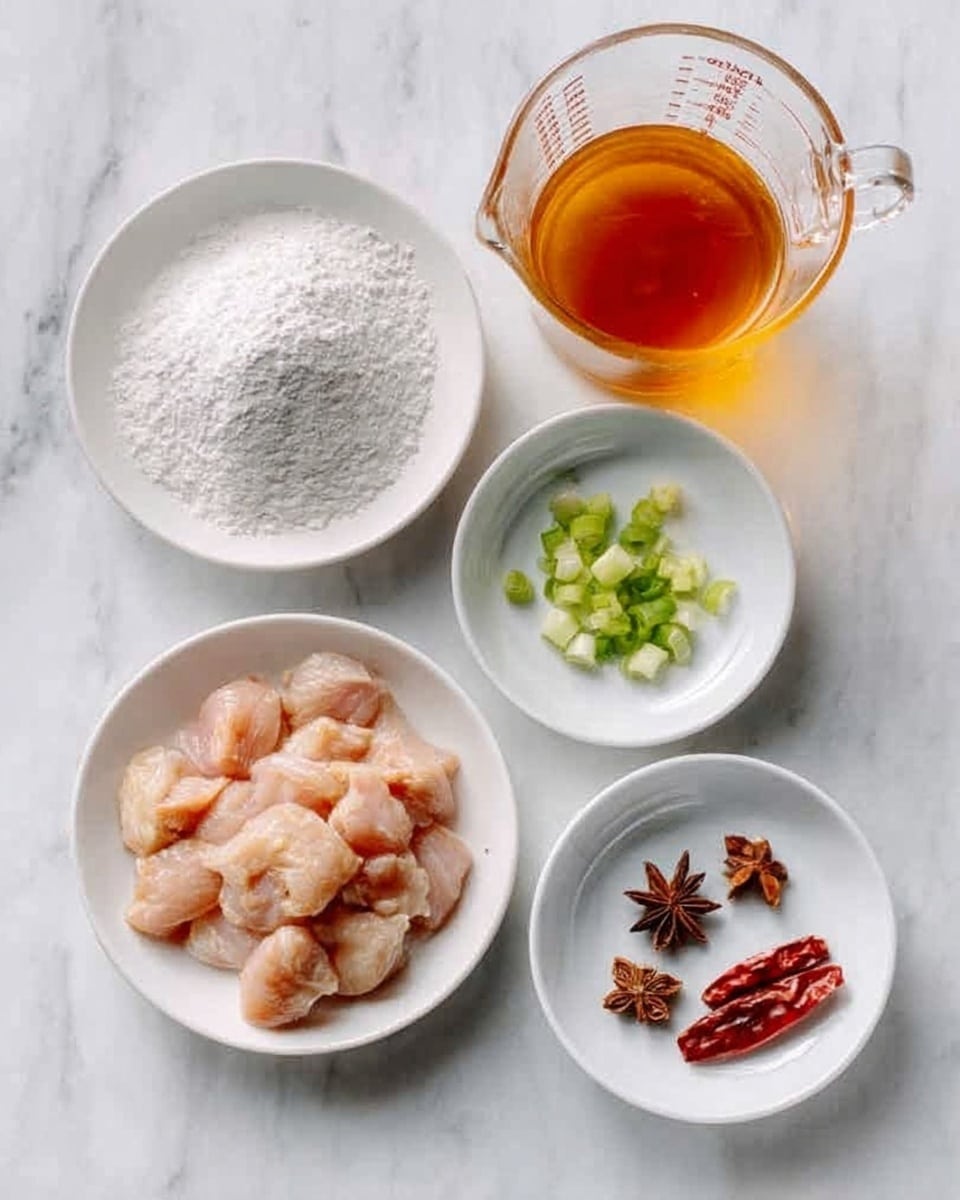 The image shows four white bowls on a white marbled surface. The top left bowl holds a pile of fine white powder. The top right bowl contains several separate ingredients arranged neatly: green onion pieces, two whole star anise, three dried red chilies, and two small brownish pieces. The bottom left bowl is filled with small raw chicken pieces, light pink in color with a smooth texture. Above the chicken, there is a clear glass measuring cup filled with an amber-colored liquid sauce. The photo is simple and clean, taken with an iphone --ar 4:5 --v 7
