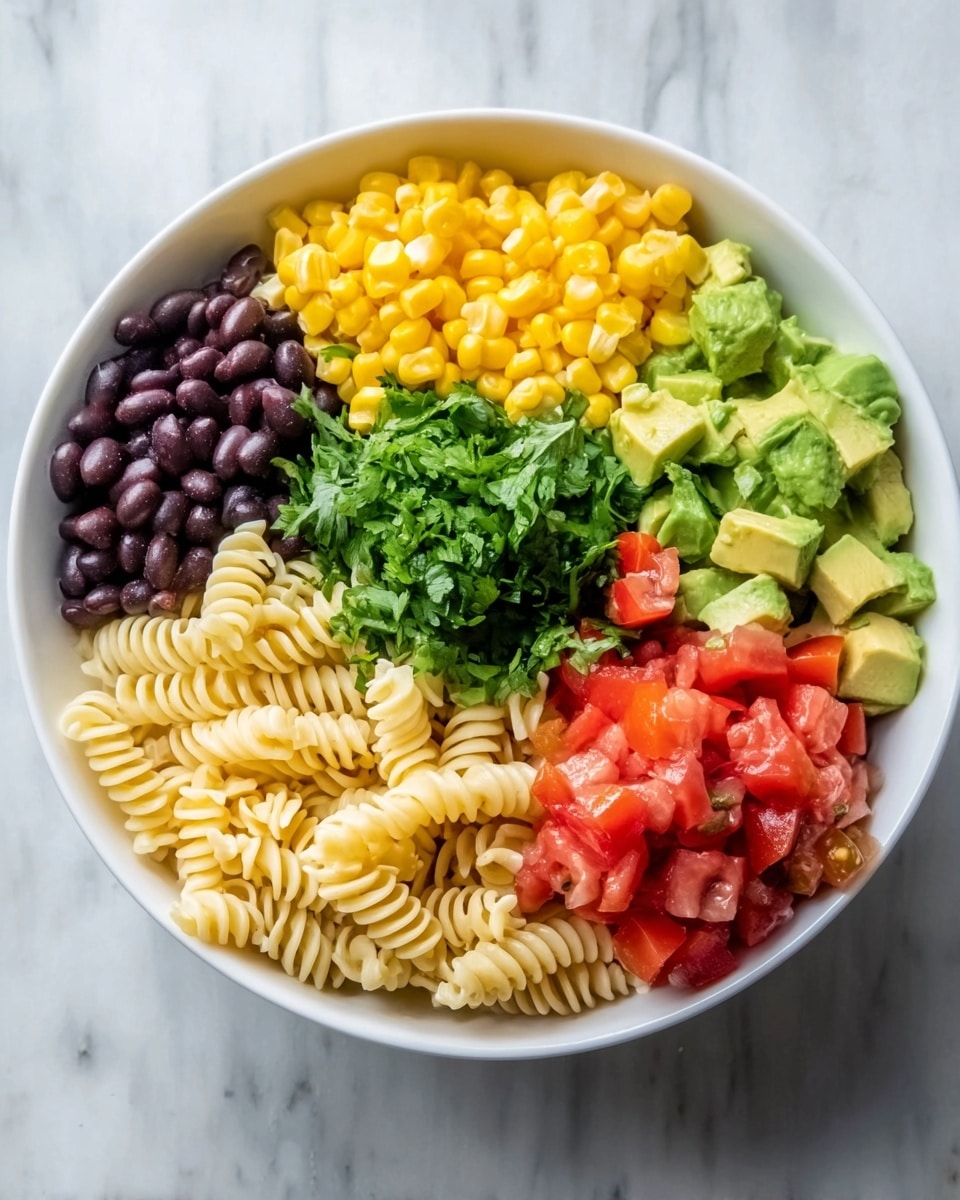 A white bowl sits on a white marbled surface, filled with six colorful layers arranged neatly side by side. At the top, there is bright yellow corn with a soft, slightly bumpy texture, next to smooth black beans. To the right is a layer of finely chopped red tomatoes with a juicy look. Below the tomatoes and beans are diced green avocado pieces, creamy and smooth. At the bottom left, pale yellow cooked spiral pasta sits tightly packed with a ridged texture. On the far left is a mound of chopped fresh green cilantro, leafy and vibrant. The dish looks fresh and clean. photo taken with an iphone --ar 4:5 --v 7