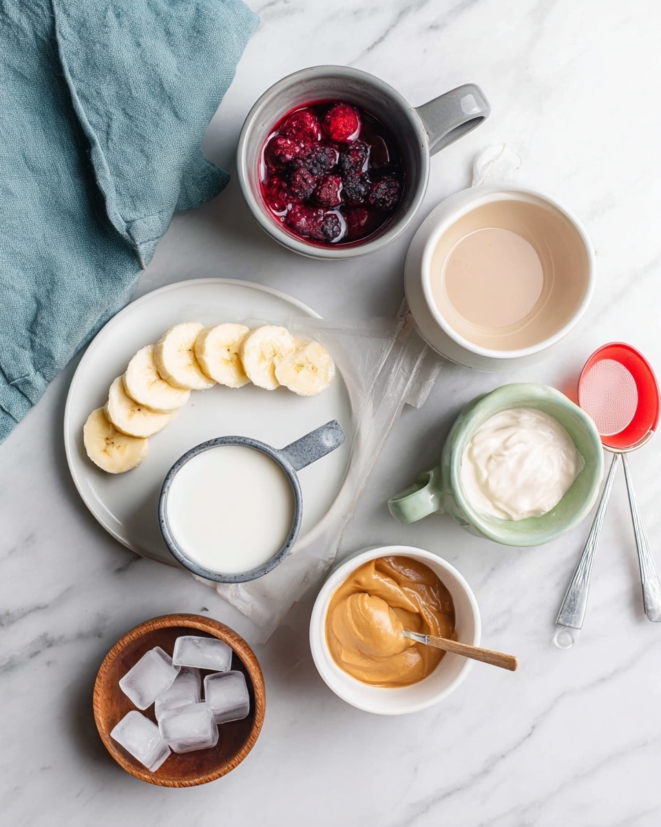 The image shows several small containers and a white plate arranged on a white marbled surface. On the white plate, there are thin yellow banana slices placed in a curved line. A gray cup filled with red and dark purple frozen berries sits near the top center. A green cup holds smooth white yogurt. A beige cup next to it contains light brown milk. A small white bowl with light brown peanut butter is placed near peeled peanuts and a silver spoon. A white cup with a red measuring scoop is filled with white powder. A small brown wooden bowl contains several clear ice cubes. A teal cloth napkin is placed toward the upper left corner. photo taken with an iphone --ar 4:5 --v 7
