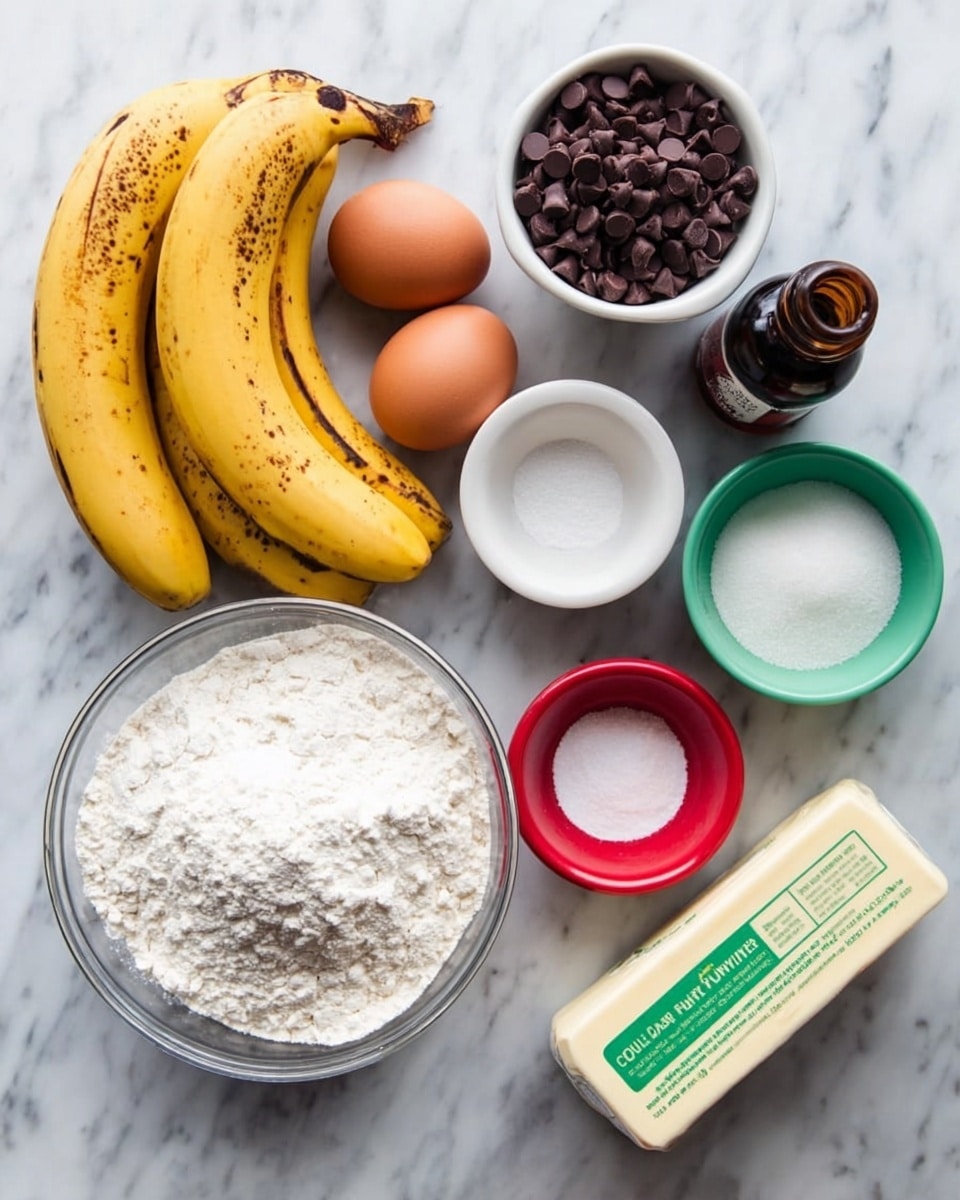 The image shows several baking ingredients arranged neatly on a white marbled surface. There are three ripe bananas with brown spots placed near two brown eggs. A clear glass bowl filled with white flour is at the bottom left. To the right of the eggs, there is a white bowl filled with small dark chocolate chips, next to a dark brown bottle of vanilla extract. Below these, there is a white bowl filled with white sugar and a smaller red bowl of salt beside it. A green bowl contains baking powder, and a stick of butter with a green label is placed at the bottom right. All items are clearly visible and set close together, creating a clean and organized layout photo taken with an iphone --ar 4:5 --v 7